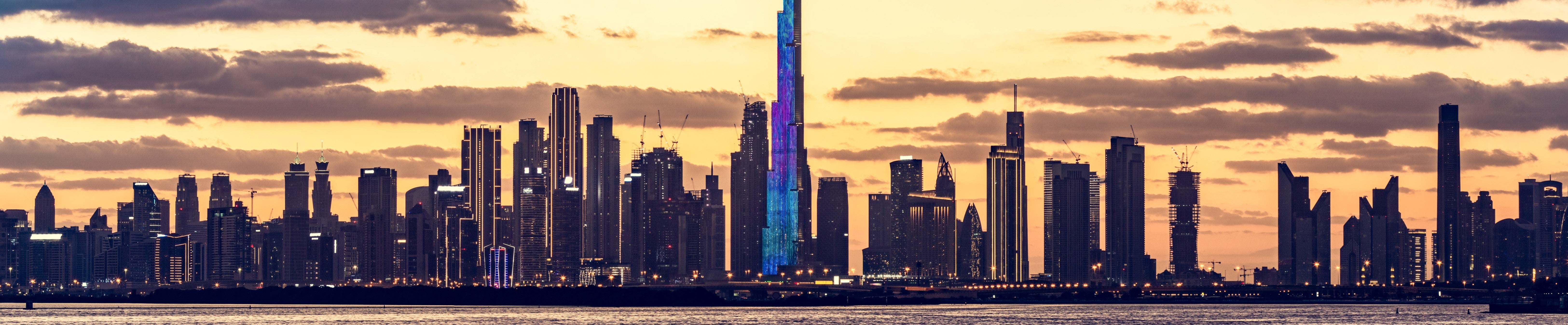 City skyline with modern skyscrapers at sunset